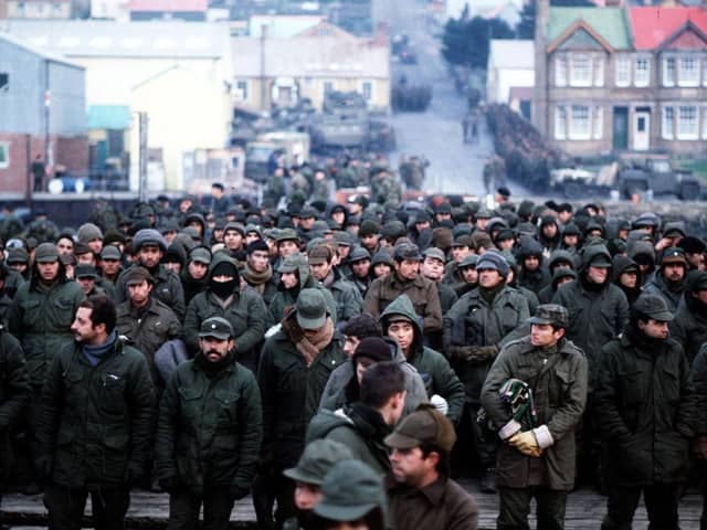 Argentine prisoners of war massed in Port Stanley, capital of the Falkland Islands, after their surrender to the British Falkland Islands Task Force. Photo: PA Wire.