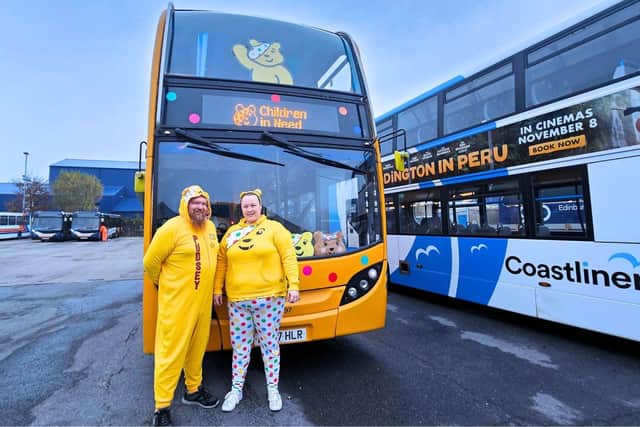 Rachael Street and Graeme Clarke in front of the 'Pudsey' bus