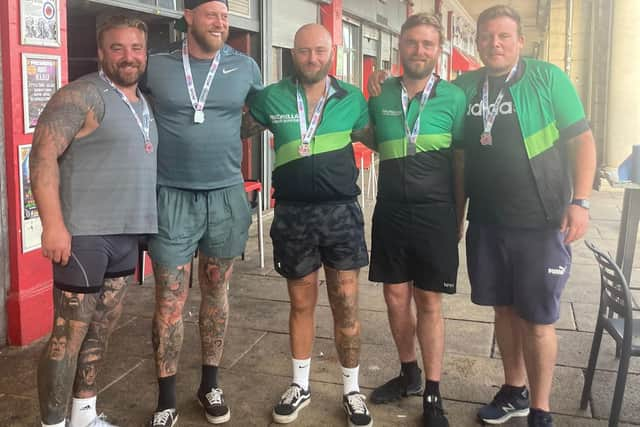 Portsmouth friends Matt Burnett, Sonny Dobson, Sam Sargeant, Shaun Legg and Dave Pike cross the London to Brighton cycle ride finish line in September.