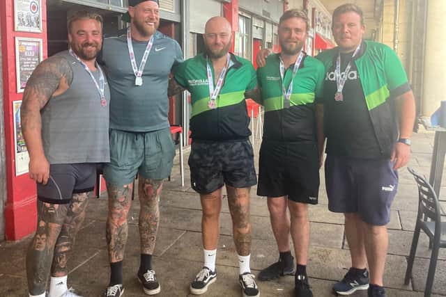 Portsmouth friends Matt Burnett, Sonny Dobson, Sam Sargeant, Shaun Legg and Dave Pike cross the London to Brighton cycle ride finish line in September.