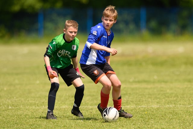 Action from the Clanfield youth football tournament at Horndean Technology College. Picture: Keith Woodland (270521-603)