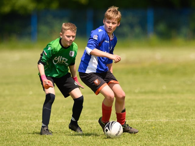 Action from the Clanfield youth football tournament at Horndean Technology College. Picture: Keith Woodland (270521-603)