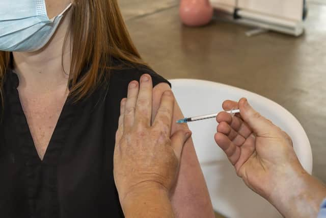 A jab being given at Cosham fire station in summer 2021 Picture: Mike Cooter (300721)