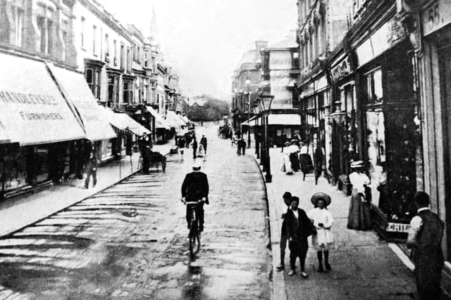Edwardian Palmerston Road. All of what you see was destroyed in the blitz of January 10, 1941. The road has just be cleaned by a water cart.