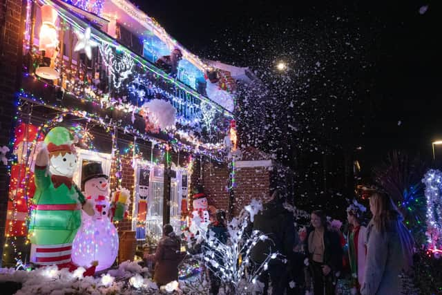 The grotto with Santa on the balcony as children enjoy the foam snow. Picture: Keith Woodland (181221-7)