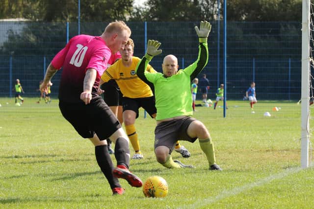 Action from the Portsmouth Sunday League Cup tie between AC FC and Fenix (yellow) which ended 6-6. Picture: Kevin Shipp.