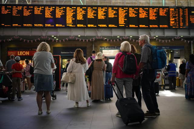 Passengers at London King's Cross station. Trains will be disrupted due to industrial action as the RMT has announced industrial action on June 21, 23, and 25. Picture date: Monday June 20, 2022.