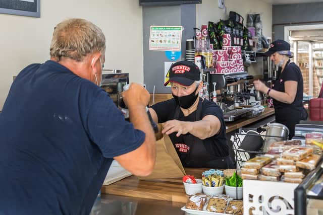Anolther customer served at the busy Whistlestop Café. Picture: Mike Cooter (150721)