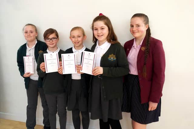 Winning team members, Sophie Ryder, Molly Bevis, Grace Morgan and Isabel Pym with Year 10 pupil, Daisy Crane.