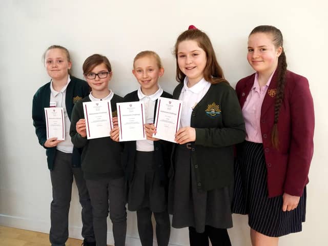 Winning team members, Sophie Ryder, Molly Bevis, Grace Morgan and Isabel Pym with Year 10 pupil, Daisy Crane.