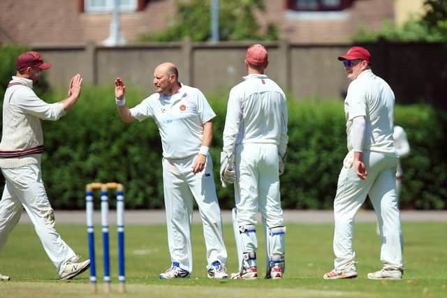 Havant's Pete Hayward, second left, celebrates taking a Gosport Borough wicket.
Picture: Chris Moorhouse