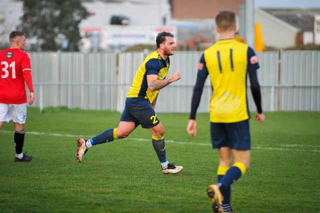 Tyler Moret celebrates his leveller against Hythe - but within minutes Moneyfields were trailing again. Picture: Dave Bodymore.