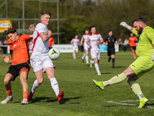 Horndean keeper Cameron Scott clears. Picture by Nathan Lipsham