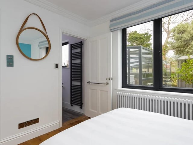 The listing says: "This attractive detached house combines the best of both worlds - a period style with a contemporary and very high specification and finish."