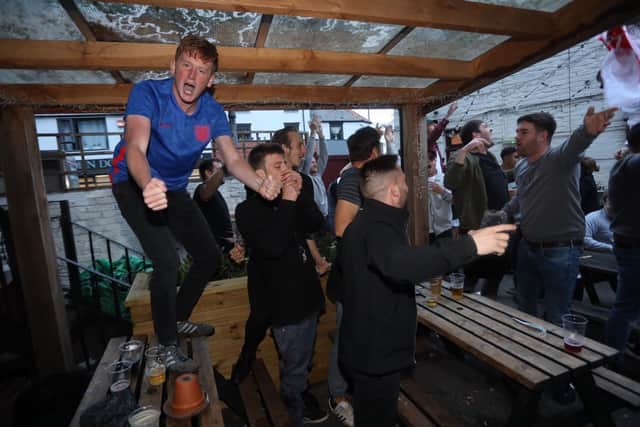 Fans at the Milton Arms celebrate England's equaliser against Denmark in the Euro 2020 semi-final 
Picture: Sam Stephenson