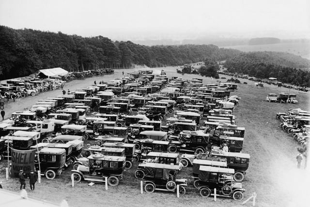 Motor cars parked at Goodwood racecourse in West Sussex.    (Photo by Topical Press Agency/Getty Images)
