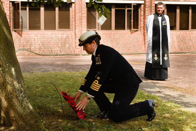 Commanding Officer Captain Catherine Jordan laid a wreath while Reverend
Jonathan Backhouse looked on.