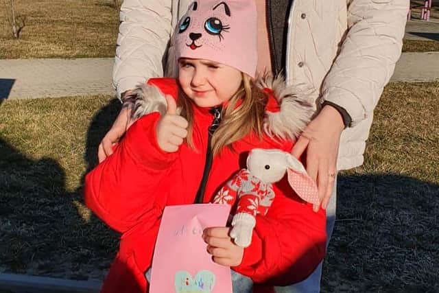 Ukrainian girl receives her gifts from the people of Clanfield and Waterlooville. Credit: Paul Mann