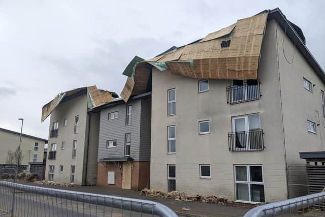 The roof has been torn off the block of flats on Howe Road. Picture: Emily Turner