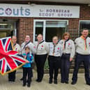 Members of Hawk District Scout Group pictured with their new flag.