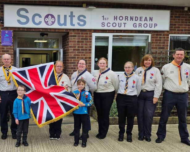 Members of Hawk District Scout Group pictured with their new flag.