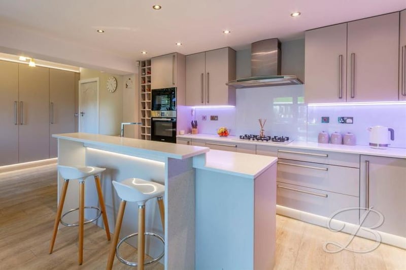 The first of several views of the stylish kitchen/diner, which has been specially designed for the modern family in mind. It comes complete with a wide range of units and cabinets.