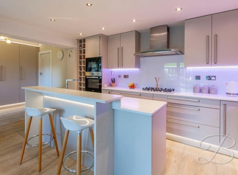 The first of several views of the stylish kitchen/diner, which has been specially designed for the modern family in mind. It comes complete with a wide range of units and cabinets.