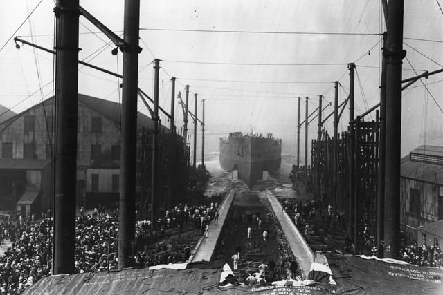 October 1913: Spectators watching the launch of the 'Queen Elizabeth' in Portsmouth. (Photo by Topical Press Agency/Getty Images)