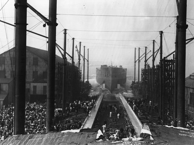 October 1913: Spectators watching the launch of the 'Queen Elizabeth' in Portsmouth. (Photo by Topical Press Agency/Getty Images)