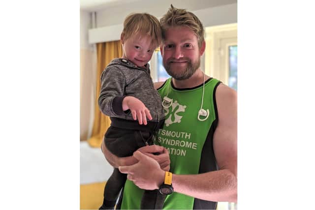 Supporters of Portsmouth Down Syndrome Association took on the T21 challenge to raise funds for the charity. Pictured: Andrew Osborne with Teddy, three