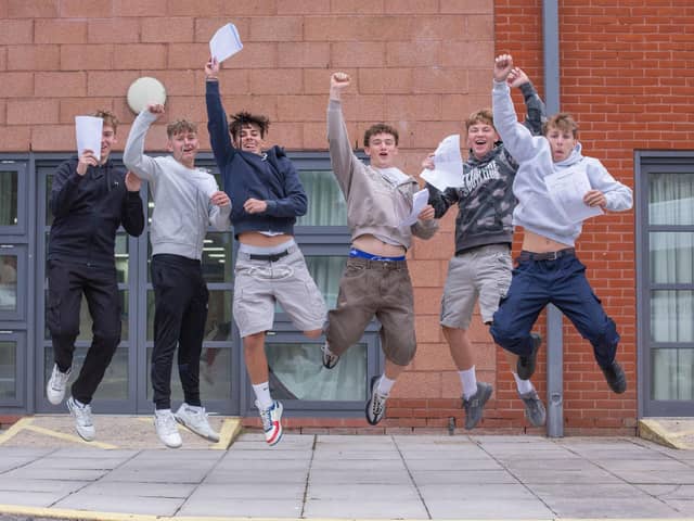 Students jump for joy at their GCSE results at Miltoncross Academy, PortsmouthPicture: Habibur Rahman