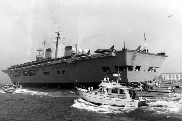 Journey over  - HMS Invincible receives a heroine's welcome as she enters Portsmouth Harbour in September 1982. Picture: Steve Taw