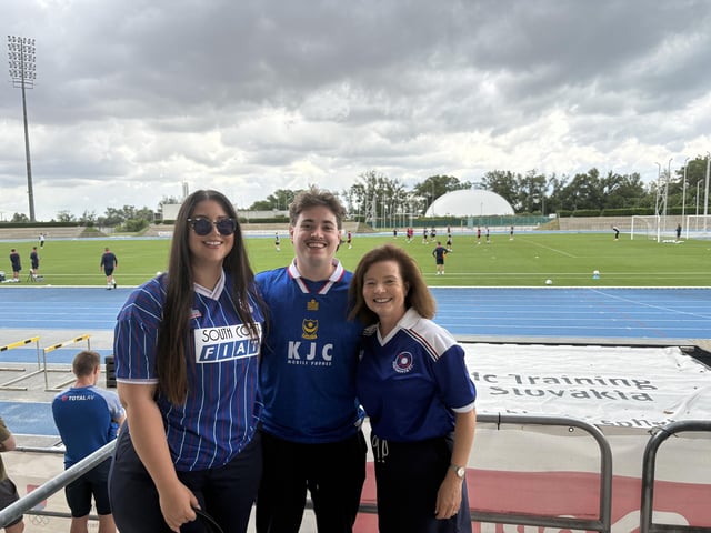Nina Mulabdic, aged 26 from Vienna, George Pearce, aged 27 from Vienna, and Melinda Pearce, aged 58 from Vienna, at Pompey's open training session at the X-Bionic Sphere Sports Centre in Šamorín, Slovakia.