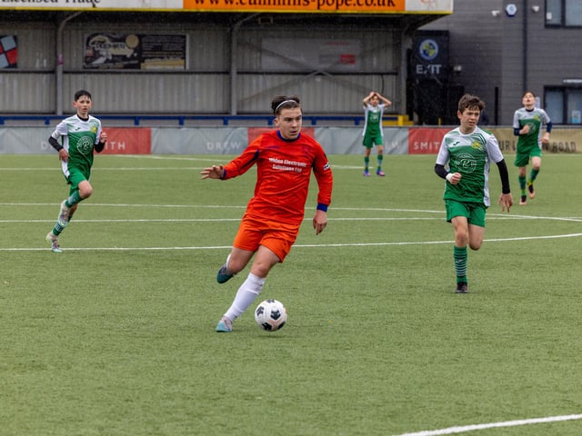 Action from the Under-13 Truman Challenge Cup final between Denmead Youth Lions (orange shirts) and Moneyfields Youth Yellow. Picture: Mike Cooter