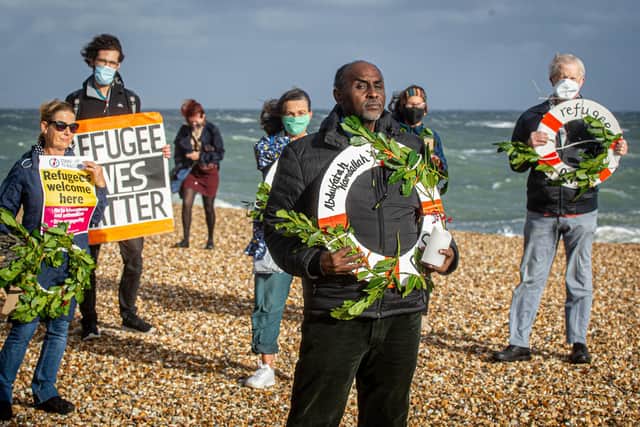 People gathered on Southsea beach with wreaths in memory of Abdulfatah Hamdallah, an asylum seeker who tragically died crossing the Channel.

Picture: Habibur Rahman