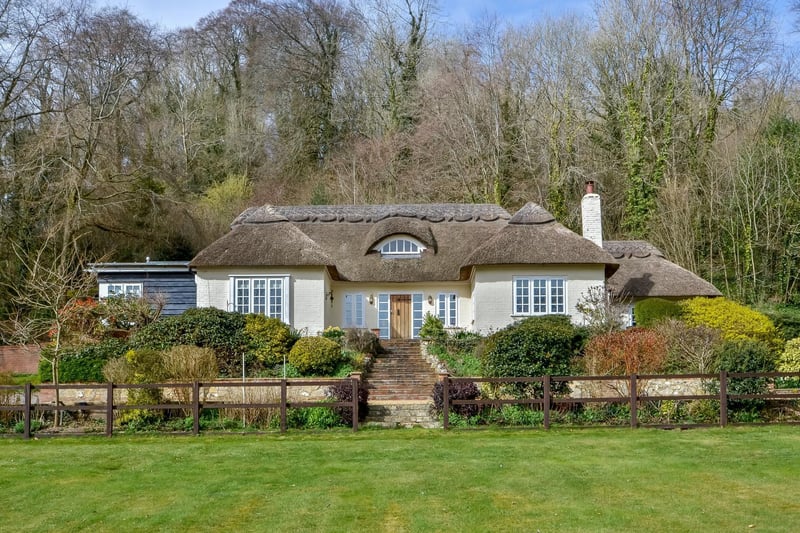 This four bedroom detached house in Hambledon is on sale for £1,895,000. It is listed by Fine and Country