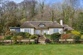 This four bedroom detached house in Hambledon is on sale for £1,895,000. It is listed by Fine and Country