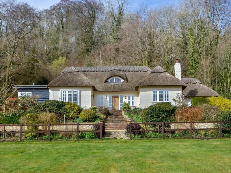 This four bedroom detached house in Hambledon is on sale for £1,895,000. It is listed by Fine and Country