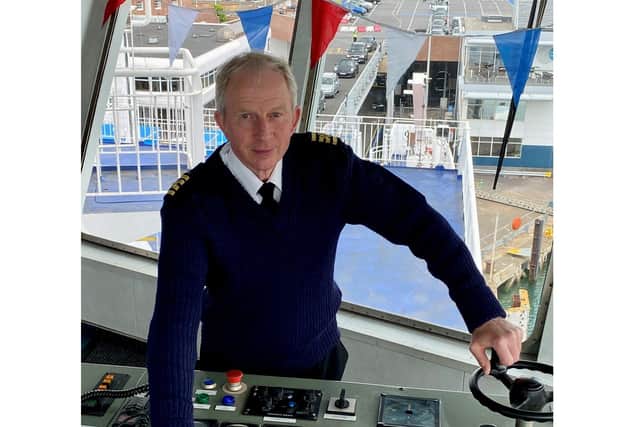 Captain Jim Blanch rehearses sounding the horn on Wightlink's car ferry St Clare.