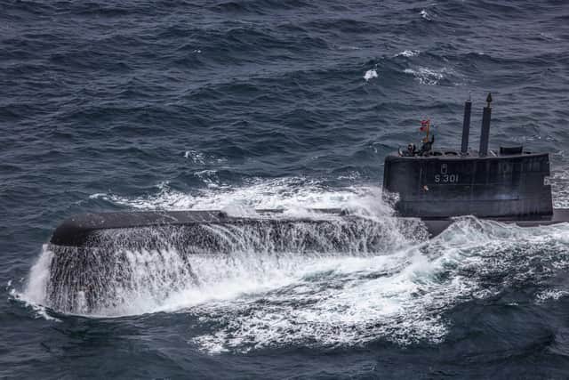 A submarine comes to the surface during exercise Dynamic Mongoose off the coast of Iceland. Photo: Royal Navy