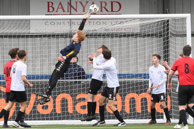 East Lodge Youth keeper Ash Woolger tips away a corner. Picture: Keith Woodland