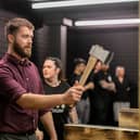 Pictured: Reporter Joe Buncle having a go at throwing an axe.

Picture: Habibur Rahman