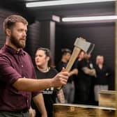 Pictured: Reporter Joe Buncle having a go at throwing an axe.

Picture: Habibur Rahman