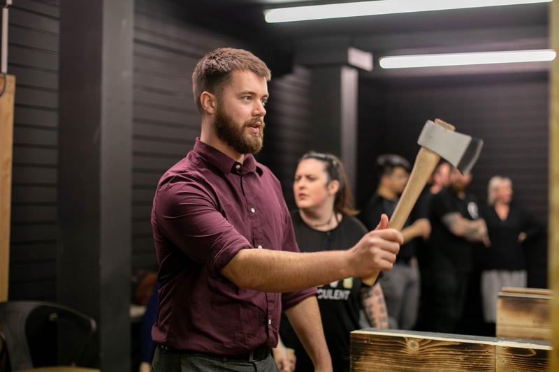 Pictured: Reporter Joe Buncle having a go at throwing an axe.
Picture: Habibur Rahman