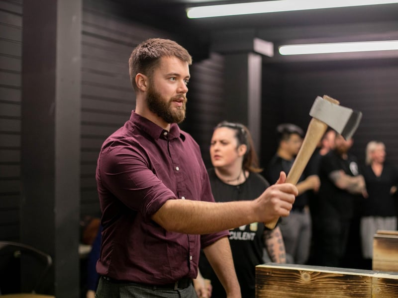 Pictured: Reporter Joe Buncle having a go at throwing an axe.
Picture: Habibur Rahman