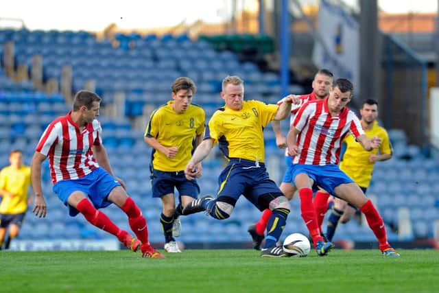 Baffins Milton Rovers (stripes) take on Moneyfields at Fratton Park in the 2013/14 Portsmouth Senior Cup final. The two clubs meet again in the delayed 2019/20 final - but no date or venue has yet been arranged. Picture: Ian Hargreaves