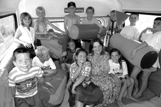 Children in the soft shapes play area on the Replay double decker bus at Bishopsfield Road, Fareham, with worker Jane Miller, July 1995. The News PP1064
