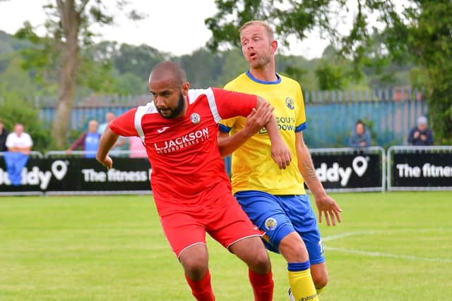 Scott Rendell, right, struck twice for Hawks