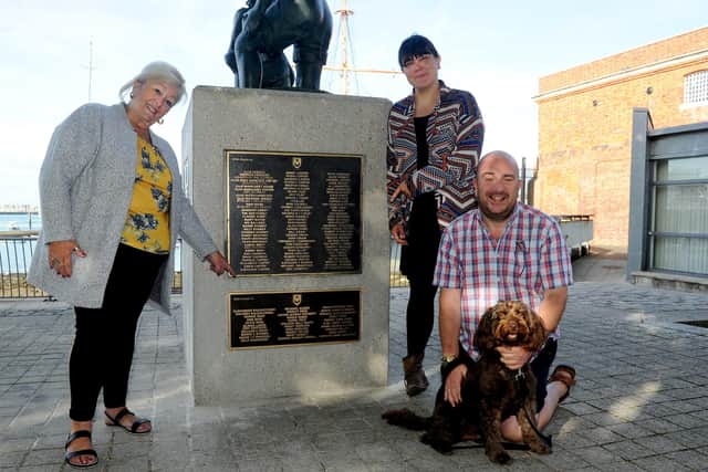 The Mud Larkers Plaque at The Hard. Margaret Foster, community campaigner, Sarah Shreeve, community campaigner and Steve Pitt with his cockapoo Finn in 2018.

Picture: Sarah Standing (180711-4316)