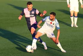 Hawks midfielder Billy Clifford, seen here in action against Dulwich Hamlet at the weekend, has been in the 'form of  his life' in recent weeks. Picture by Dave Haines